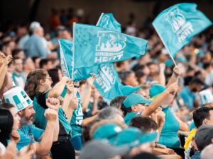Brisbane Heat fans wave flags at the Gabba, where Baker Boy will headline the New Year's Bash
