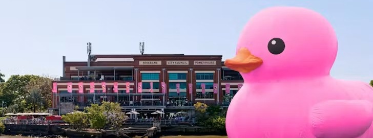 Giant pink Rubber Duck beside Brisbane Powerhouse on the river for Melt Festival